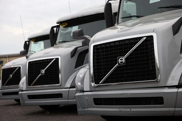 The Swedish truckmaker reported a larger than expected drop in operating profit on Thursday. Despite the decline, Volvo raised its outlook for truck sales.