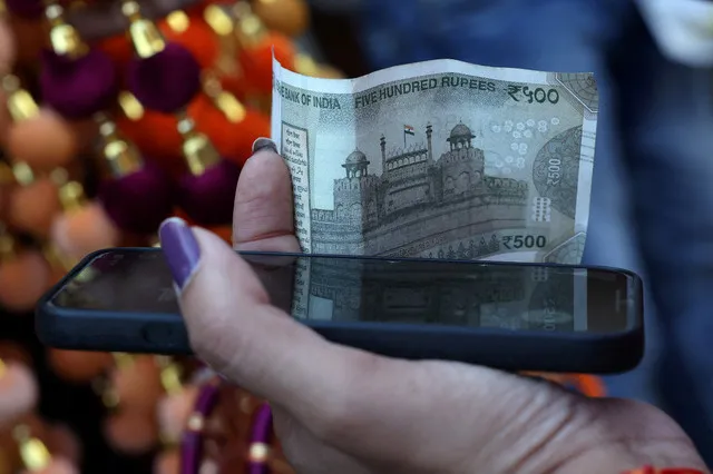 The Indian rupee fell 0.2 percent on Friday as crude oil prices remained above 100 dollars per barrel. State-run banks intervened to cushion the currency's slide.