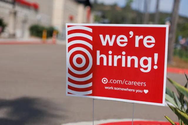 A "we're hiring" sign is displayed outside a Target store, after U.S. employment growth slowed more than expected in July, in Encinitas, California, U.S. August 1, 2025. REUTERS/Mike Blake
